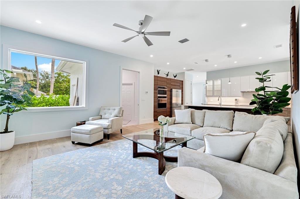 2515 Royal Palm Court Naples, FL 34103 - Photo 5 of 32 a living room with furniture and a large window