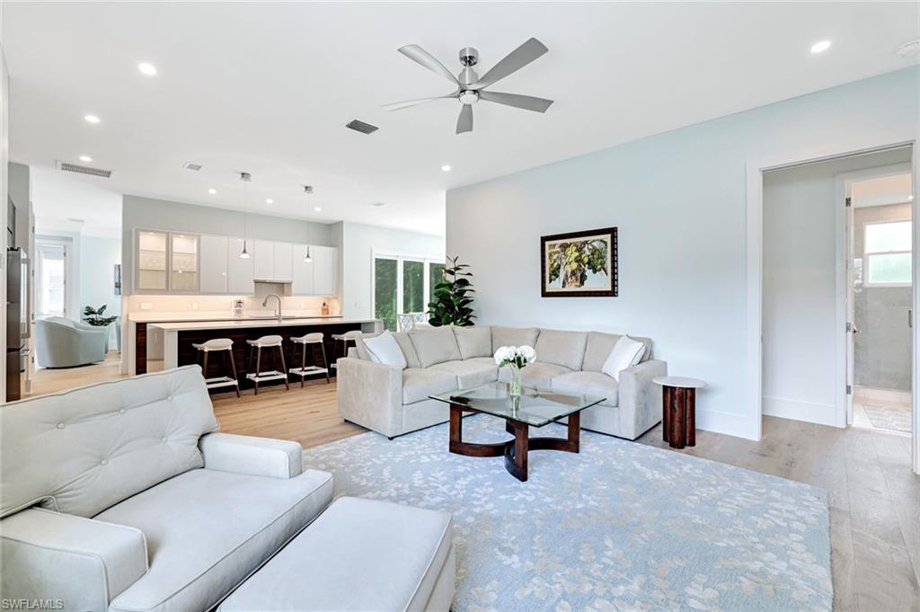 2515 Royal Palm Court Naples, FL 34103 - Photo 7 of 32 a living room with furniture and kitchen view