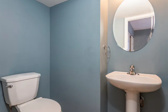 a bathroom with a toilet and a sink