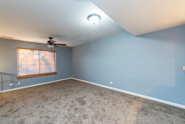 an empty room with a empty space and windows