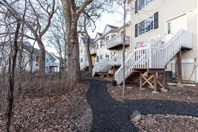 a view of a chair and table in backyard