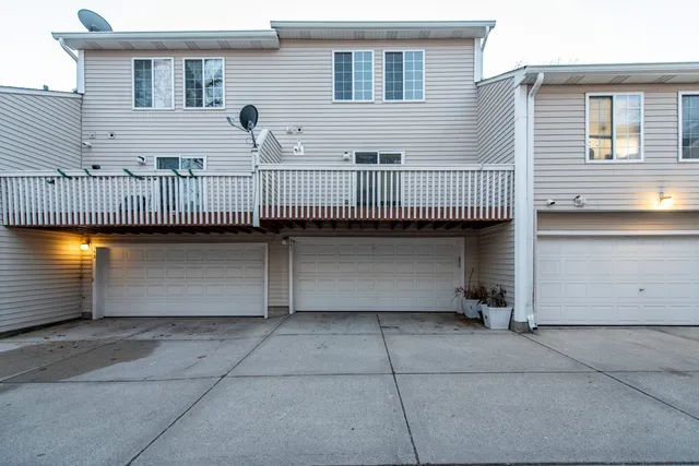 a view of a brick house with many windows