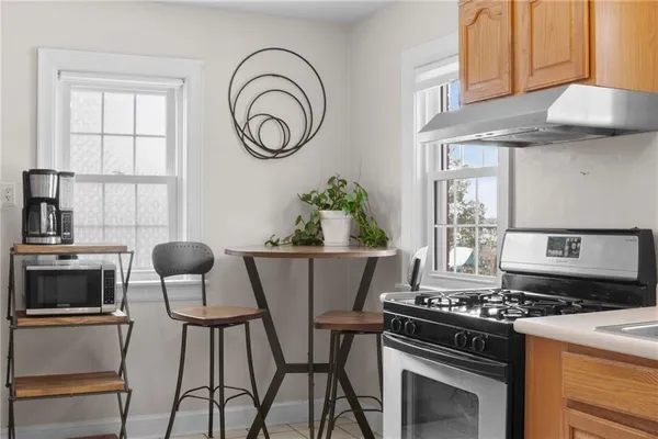 a dining room with furniture and window