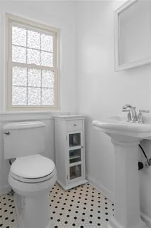 a bedroom with a bed and a flat screen television