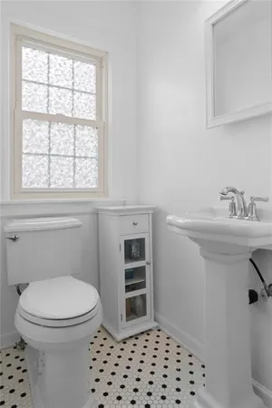 a bedroom with a bed and a flat screen television