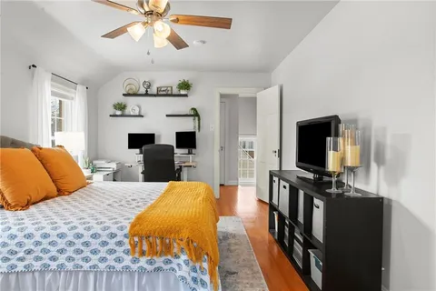 a bedroom with a large bed and a window