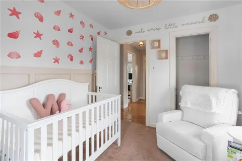 a bathroom with a sink a mirror and a shower