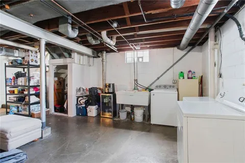 a view of dirt yard and a large tree