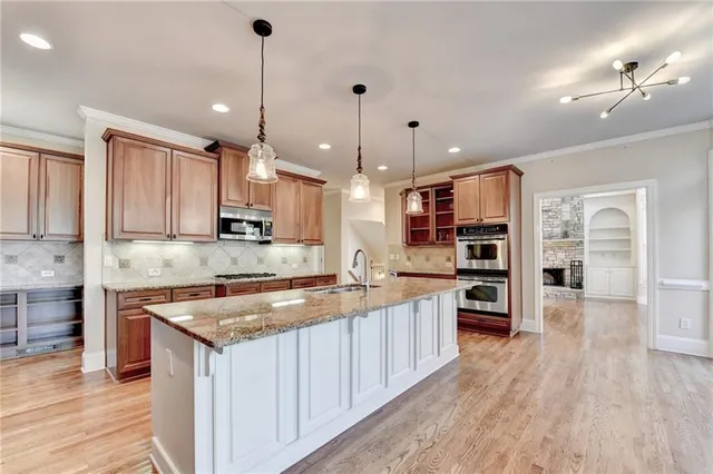 a view of a kitchen with a sink and cabinets