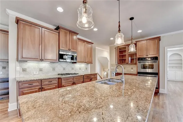 a view of a livingroom with a fireplace wooden floor and windows