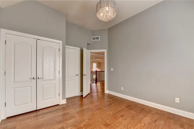 a view of a porch with wooden floor and fence