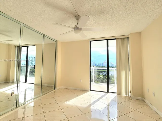 a view of an empty room with glass door