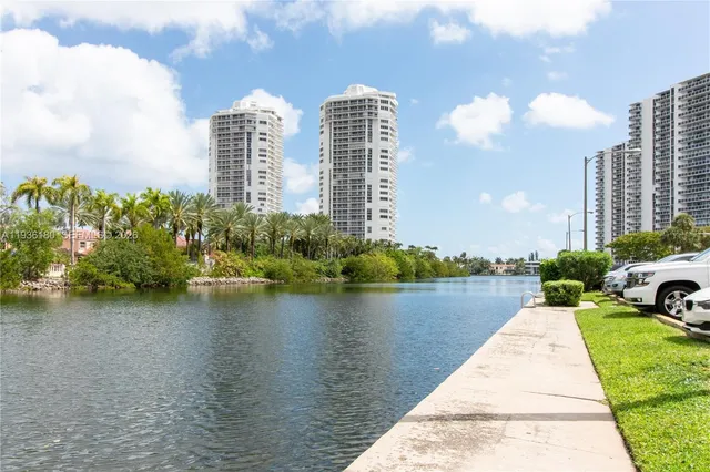 a view of a lake with tall building