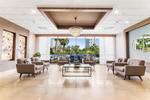 a living room with fireplace furniture and a large window