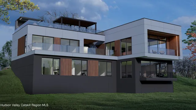 a front view of house with yard and trees