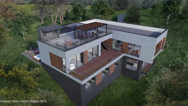 a view of a house with a big yard and large trees