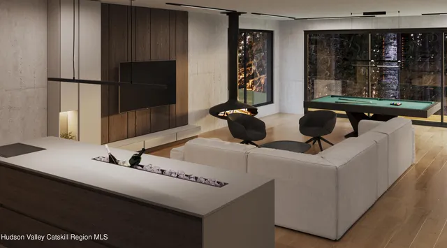 a living room with a couch and a potted plant