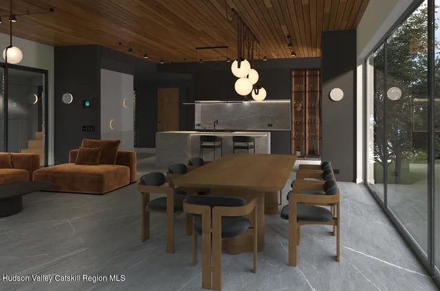 a balcony with furniture and a large window