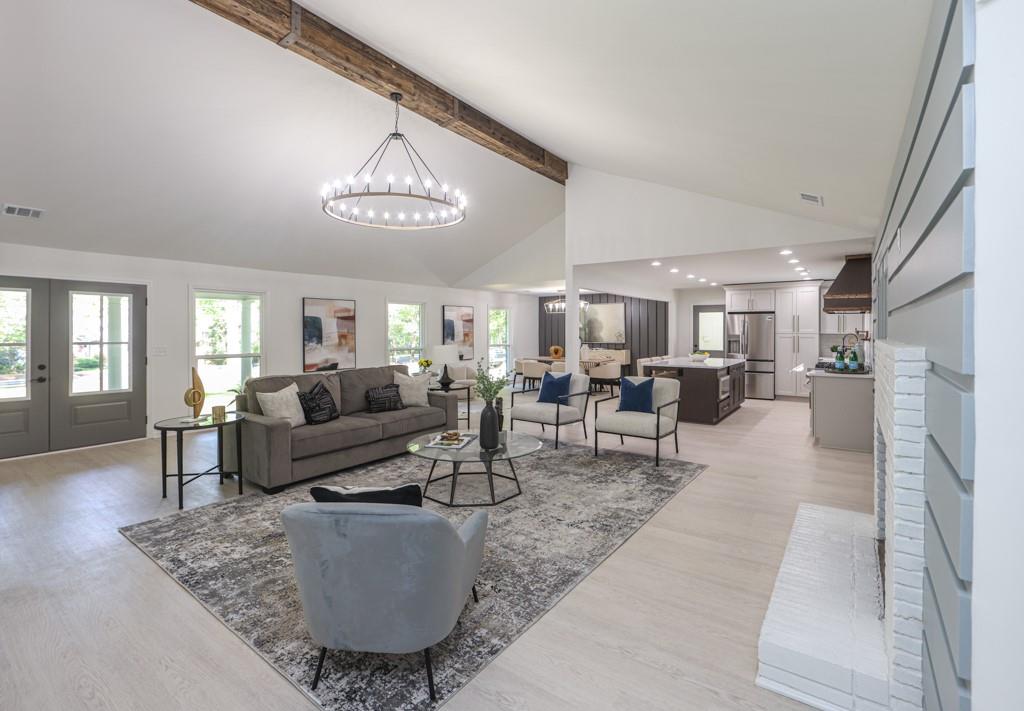6970 Brandon Mill Road Northwest Sandy Springs, GA 30328 - Photo 1 of 1 a living room with furniture and a table
