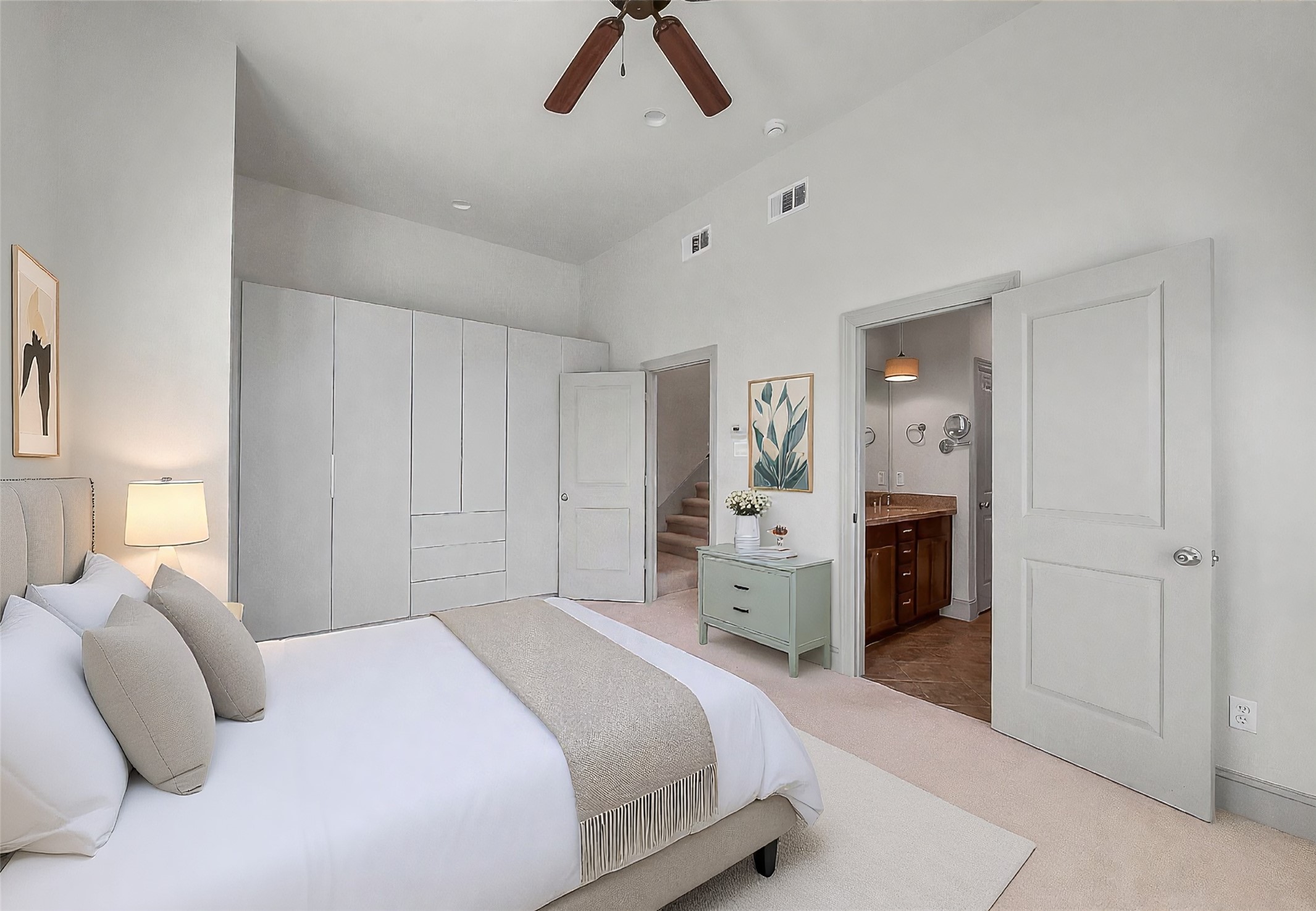 1929 Summer Street Houston, TX 77007 - Photo 15 of 27 Another view of the primary suite highlights the impressive wall of added built-in storage—both stylish and functional. The furniture in this photo is virtually staged.