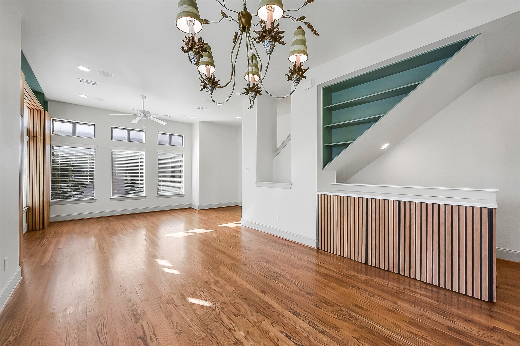 1929 Summer Street Houston, TX 77007 - Photo 8 of 27 Another angle of the dining space highlights the generous room for a large table and additional furniture such as a buffet. Open flow to the living room makes hosting effortless. Notice the nice built-in storage with a quartz countertop along the staircase.