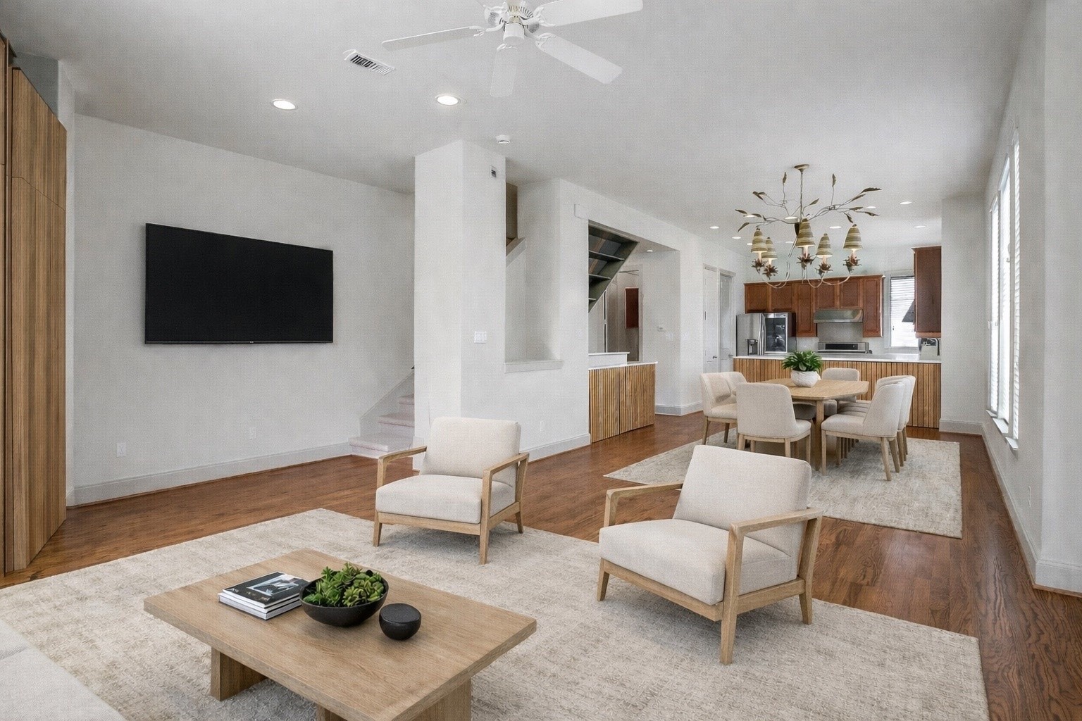 1929 Summer Street Houston, TX 77007 - Photo 9 of 27 Another living room angle facing the stairs to the third floor. Spacious layout allows for large furnishings and easy entertaining with the open connection to kitchen and dining.The furniture in this photo is virtually staged.