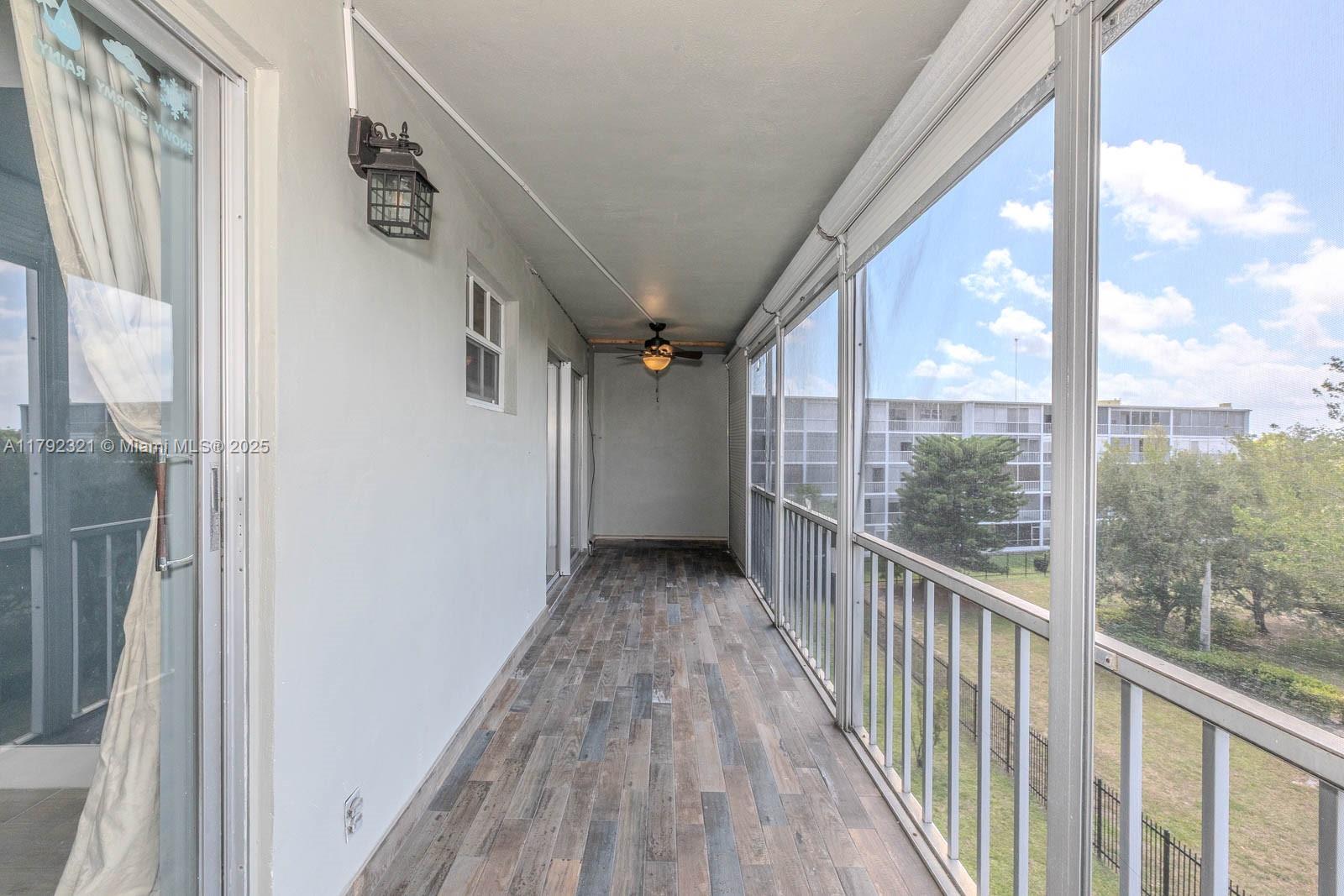 950 Hillcrest Drive, Unit 414 Hollywood, FL 33021 - Photo 17 of 51 a view of a balcony with wooden floor