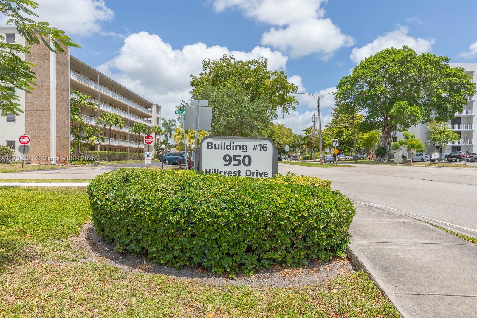 950 Hillcrest Drive, Unit 414 Hollywood, FL 33021 - Photo 2 of 51 a sign on the side of the road