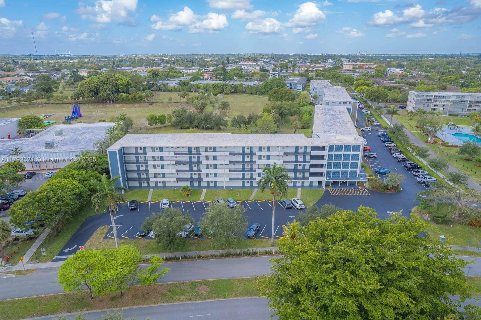 950 Hillcrest Drive, Unit 414 Hollywood, FL 33021 - Photo 38 of 51 an aerial view of a house with a yard and lake view