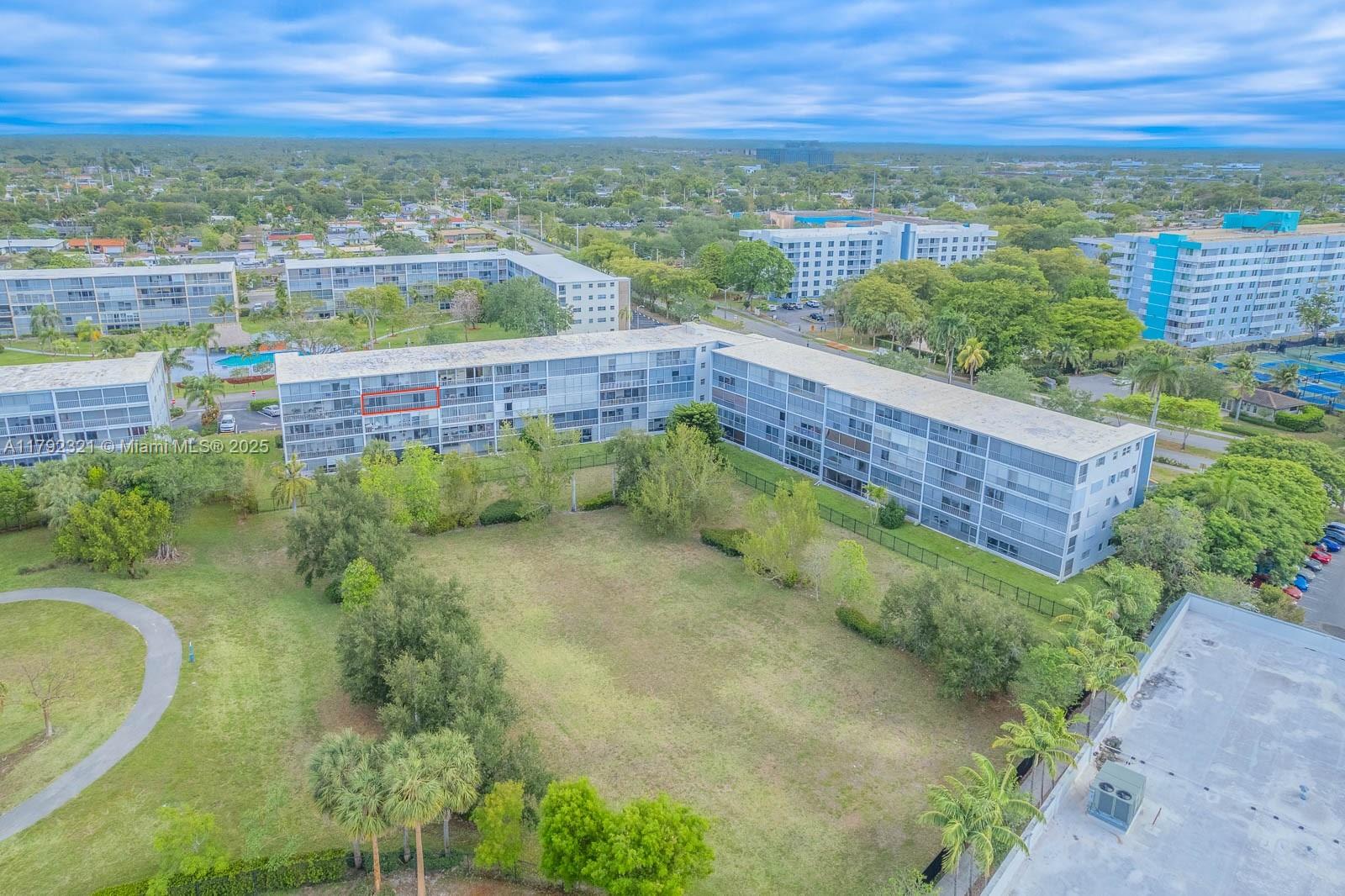 950 Hillcrest Drive, Unit 414 Hollywood, FL 33021 - Photo 39 of 51 a view of a swimming pool with a lake view