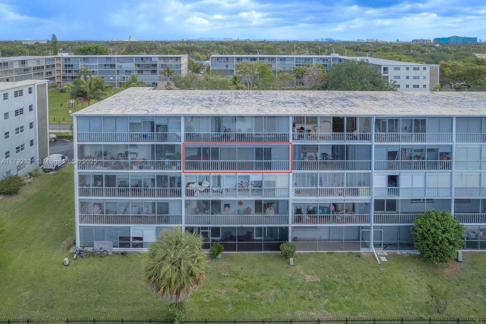 950 Hillcrest Drive, Unit 414 Hollywood, FL 33021 - Photo 40 of 51 a view of a city with tall buildings and a big yard