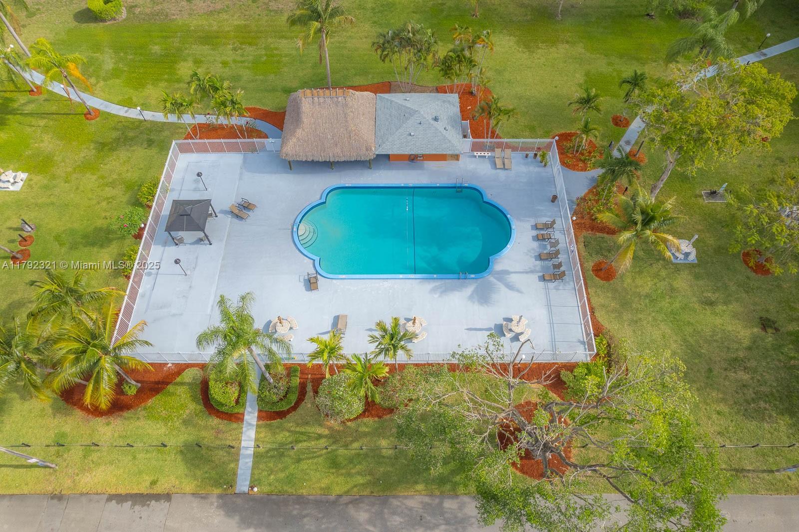 950 Hillcrest Drive, Unit 414 Hollywood, FL 33021 - Photo 47 of 51 an aerial view of a house with a swimming pool
