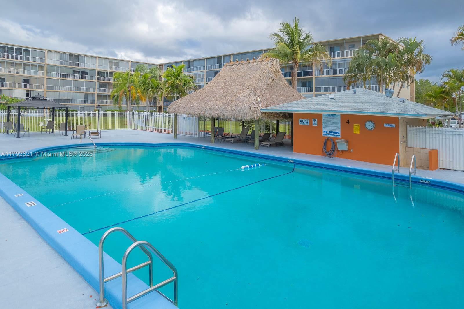 950 Hillcrest Drive, Unit 414 Hollywood, FL 33021 - Photo 49 of 51 swimming pool view with a seating space
