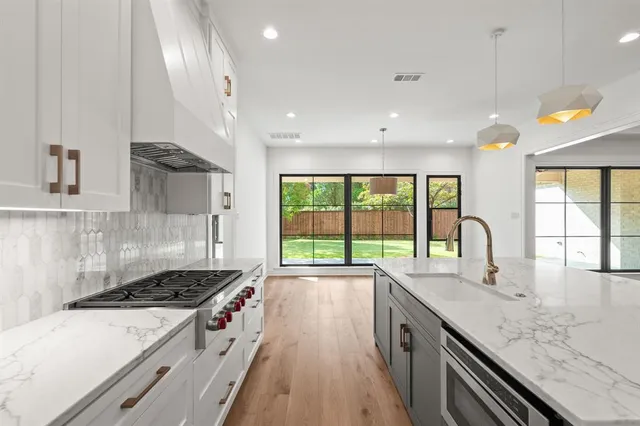 a kitchen with a stove and a sink