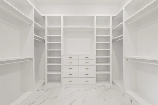 a view of an empty walk in closet