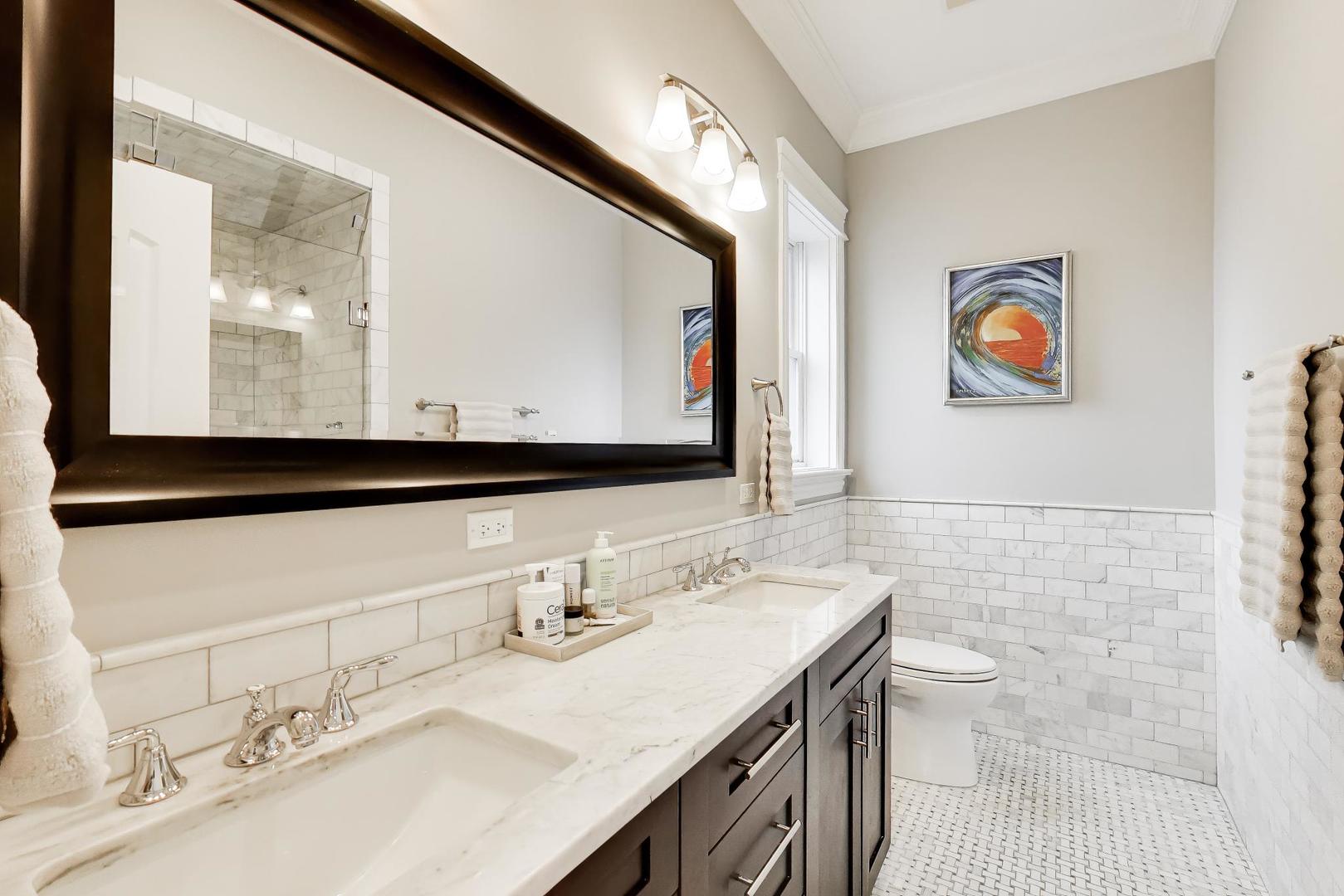 2680 North Orchard Street, Unit 3 Chicago, IL 60614 - Photo 11 of 26 a bathroom with a sink vanity and a mirror