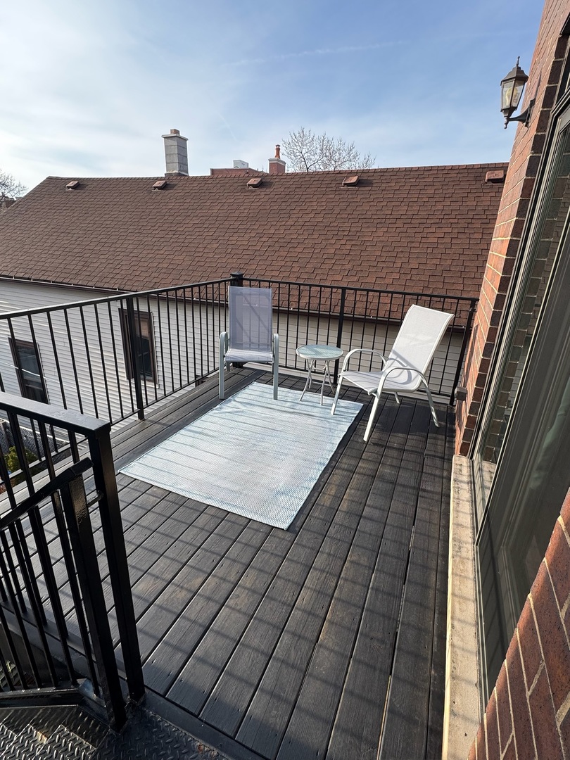 2680 North Orchard Street, Unit 3 Chicago, IL 60614 - Photo 13 of 26 a terrace view with glass windows and fence