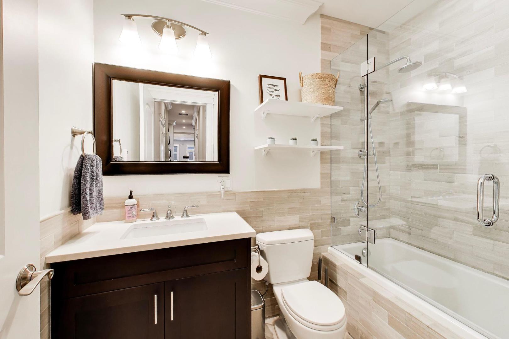 2680 North Orchard Street, Unit 3 Chicago, IL 60614 - Photo 18 of 26 a bathroom with a toilet sink vanity tub and shower