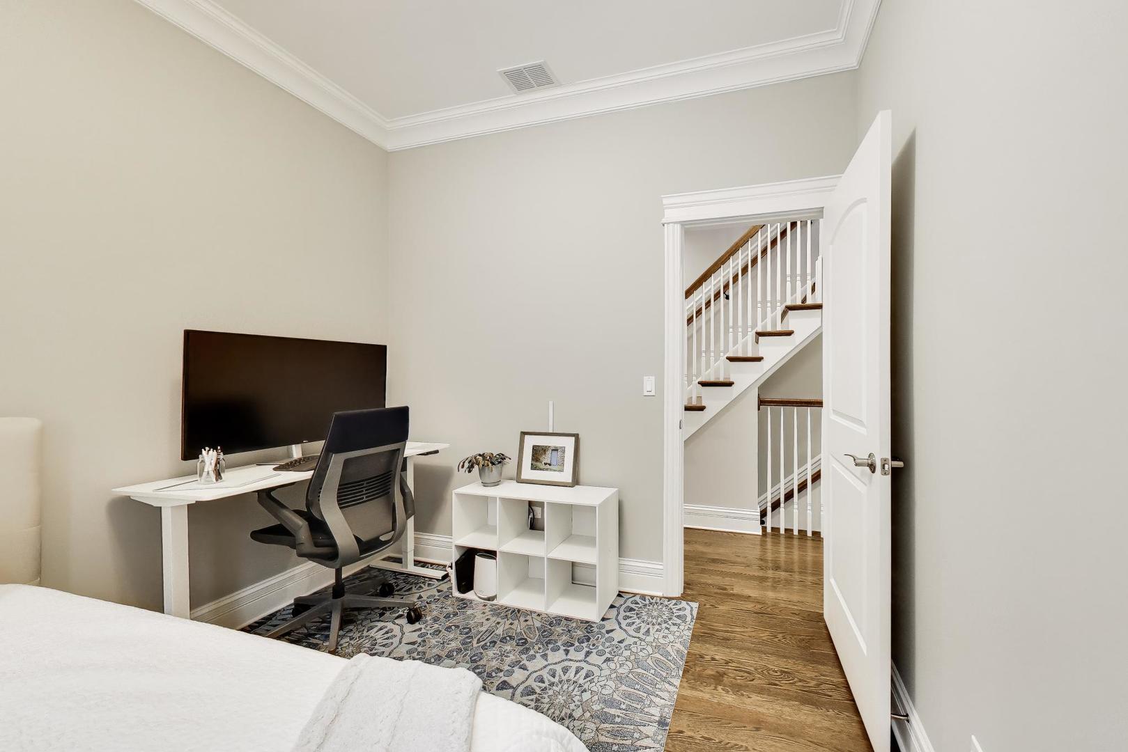 2680 North Orchard Street, Unit 3 Chicago, IL 60614 - Photo 20 of 26 a workspace with wooden floor and a rug