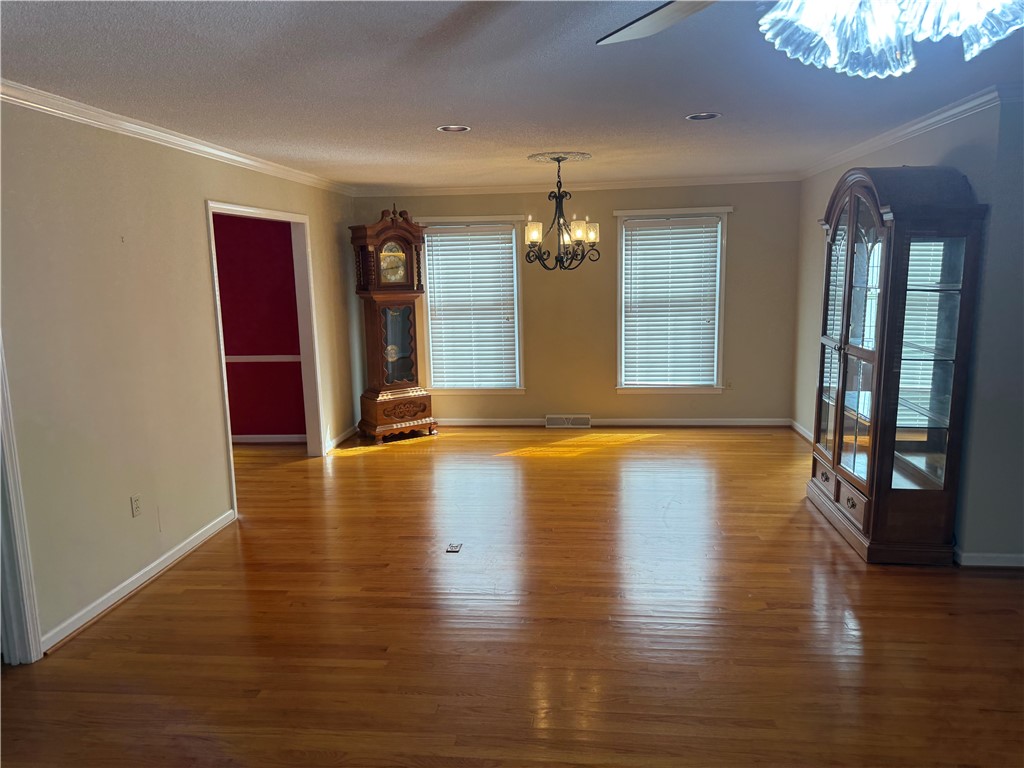 121 Nautical Way Anderson, SC 29625 - Photo 14 of 37 Natural light illuminates rich hardwood floors in this spacious, open-concept living area.