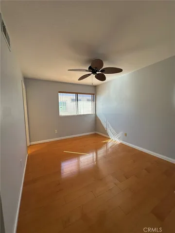 an empty room with a empty space and windows