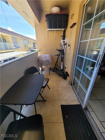 a room with wooden floor and furniture