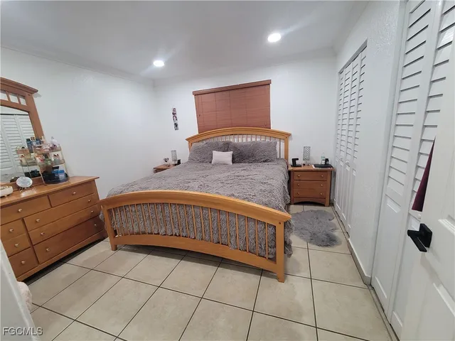 a bedroom with a bed and a dresser