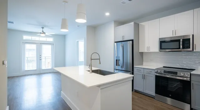 a kitchen with a stove and a microwave