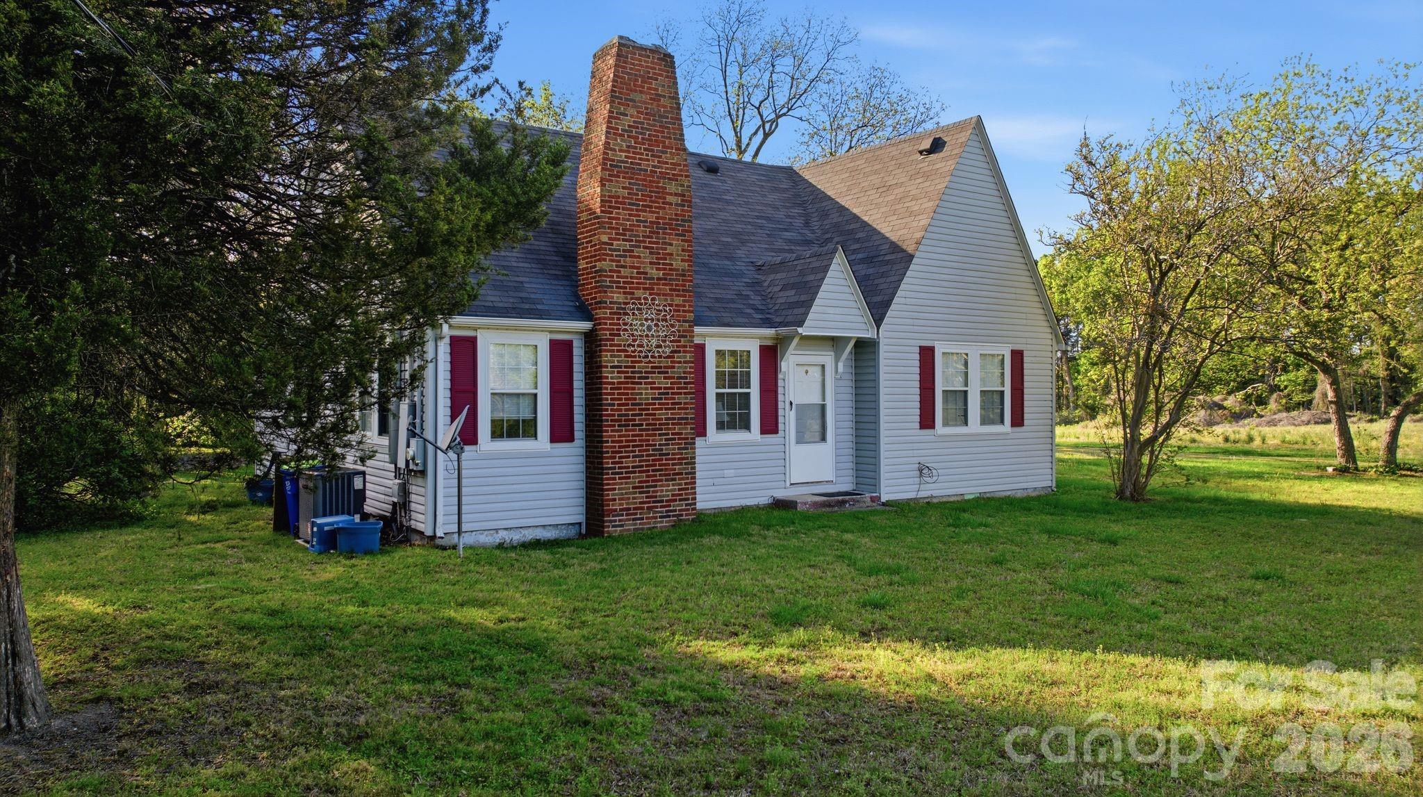 1862 Salem Church Road Lincolnton, NC 28092 - Photo 6 of 12 a view of a house with a yard and sitting area