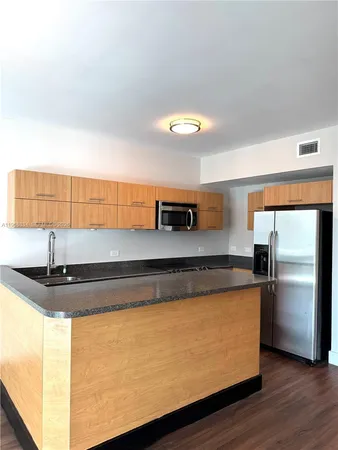 a view of room with window and hardwood floor