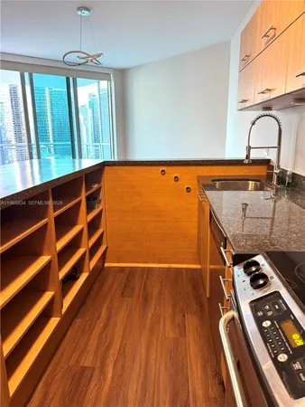 a view of a kitchen with stainless steel appliances