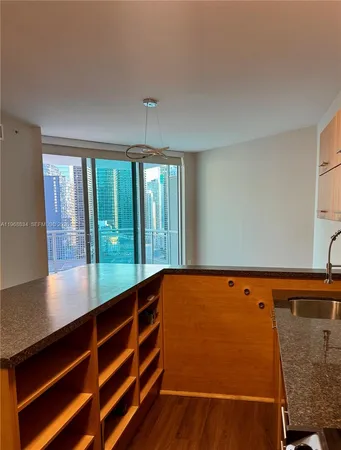 a view of room with window and hardwood floor