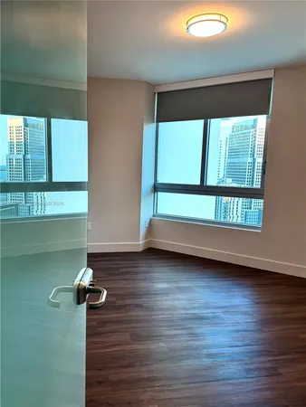 a bathroom with a sink toilet and mirror