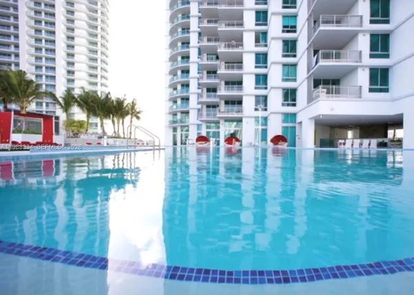 a room with gym equipment and mirrors